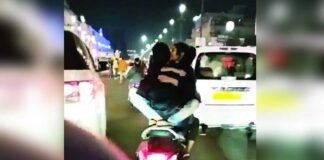 लखनऊ में अश्लीलता की हदें पार!, चलती स्कूटी पर युवक की गोद में बैठी युवती, रोमांस करते Video वायरल